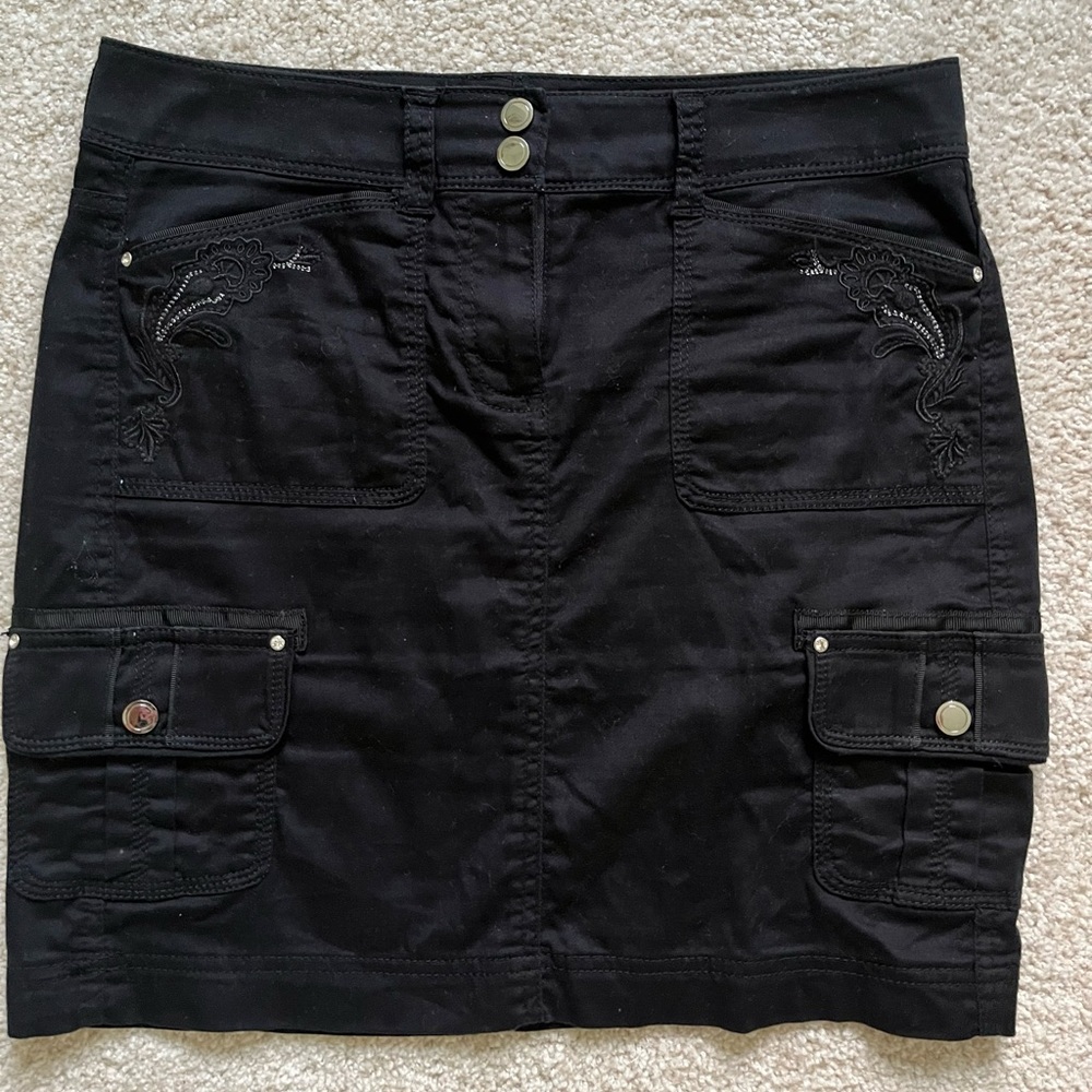 Black cargo skirt with silver stitching on pockets